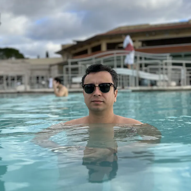 Abozar in sunglasses in the warm thermal pool at Terme di Saturnia